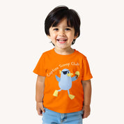 Child wearing an orange t-shirt with a cartoon character and text on a white background.