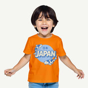 Child wearing an orange t-shirt with a 'Japan' graphic on a white background