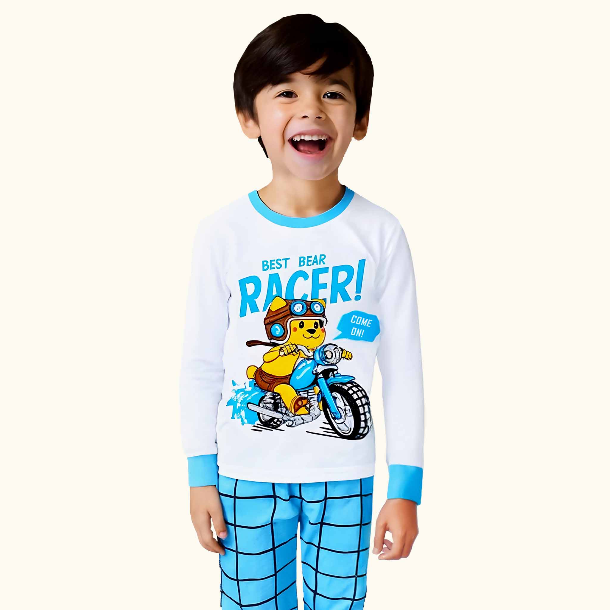 Child wearing a pajama set with a bear racer design on a white background