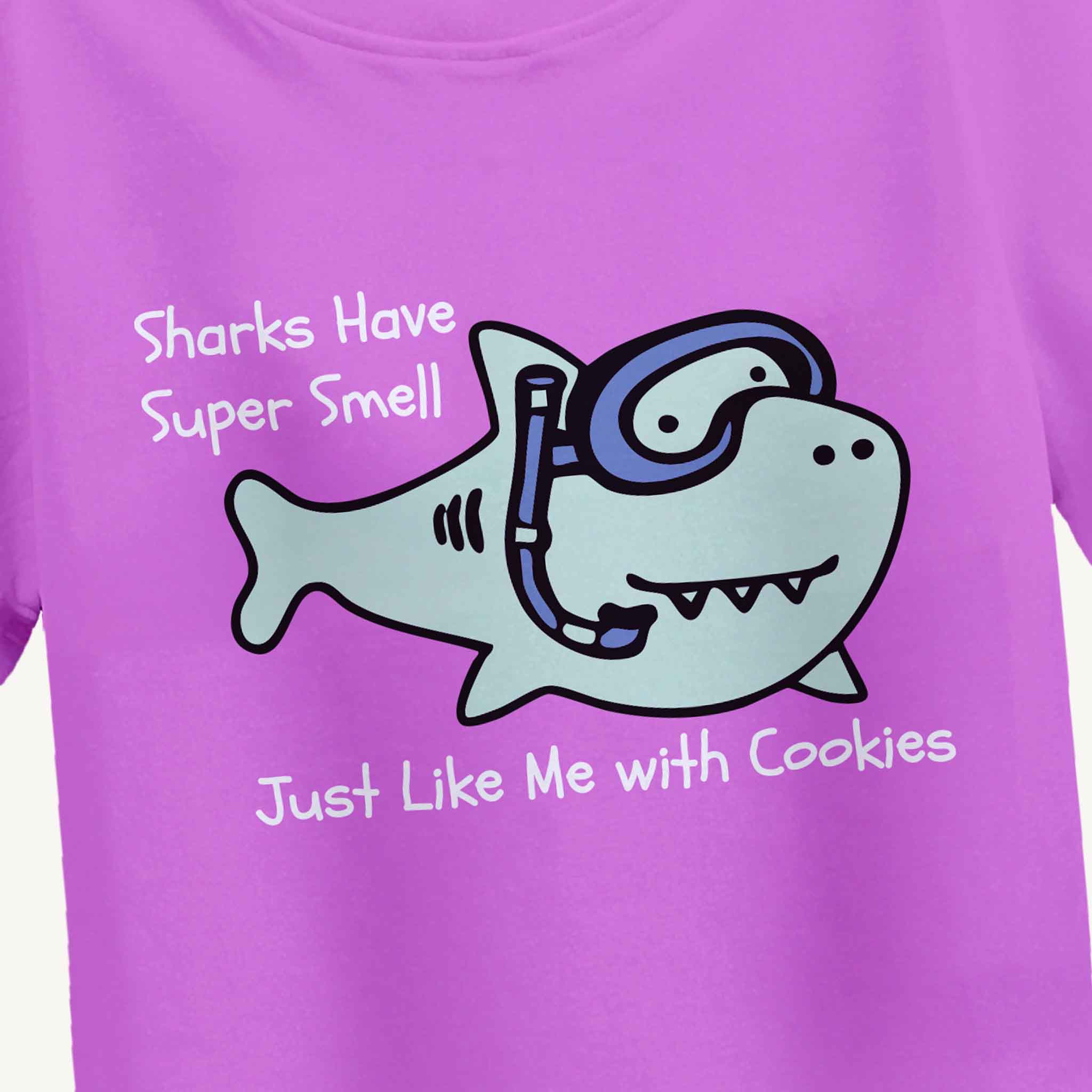 lavender t-shirt with a cartoon shark and text on a white background