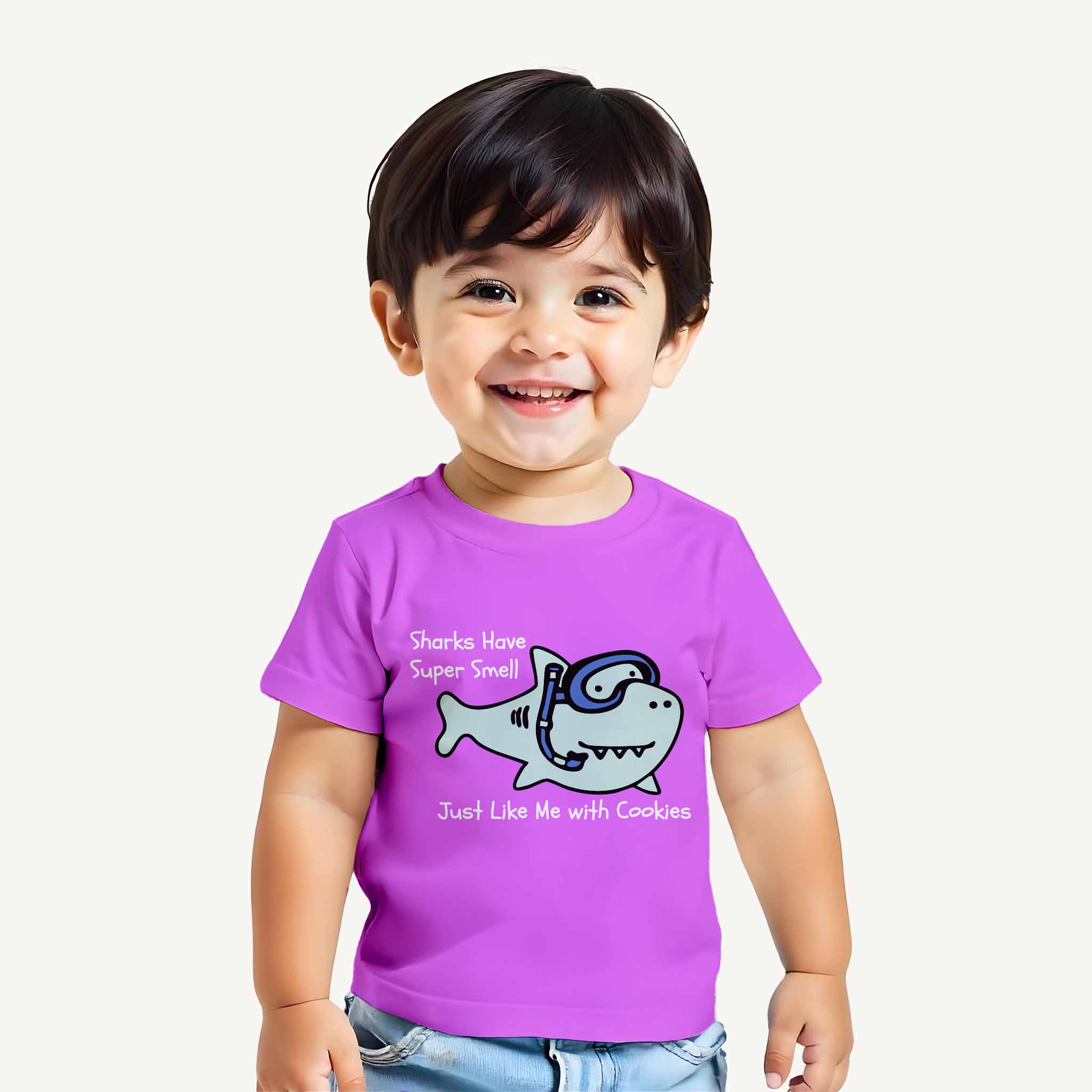 Child wearing lavender t-shirt with a shark graphic and text on a white background