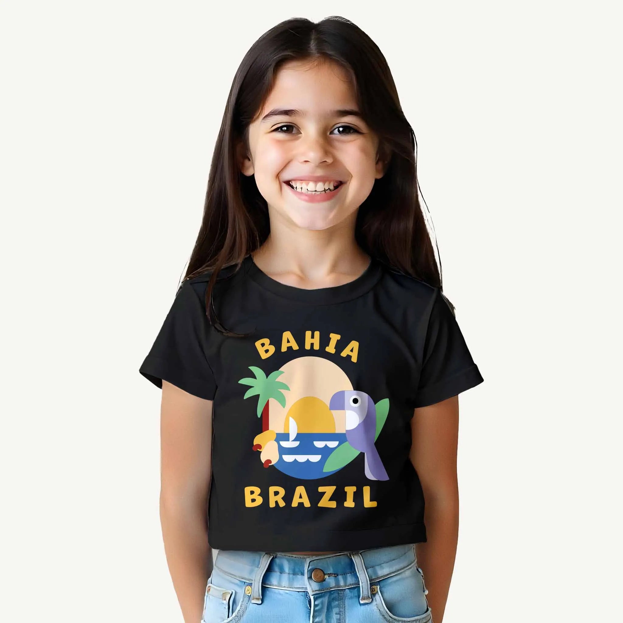 Child wearing a black t-shirt with 'Bahia Brazil' design on a white background