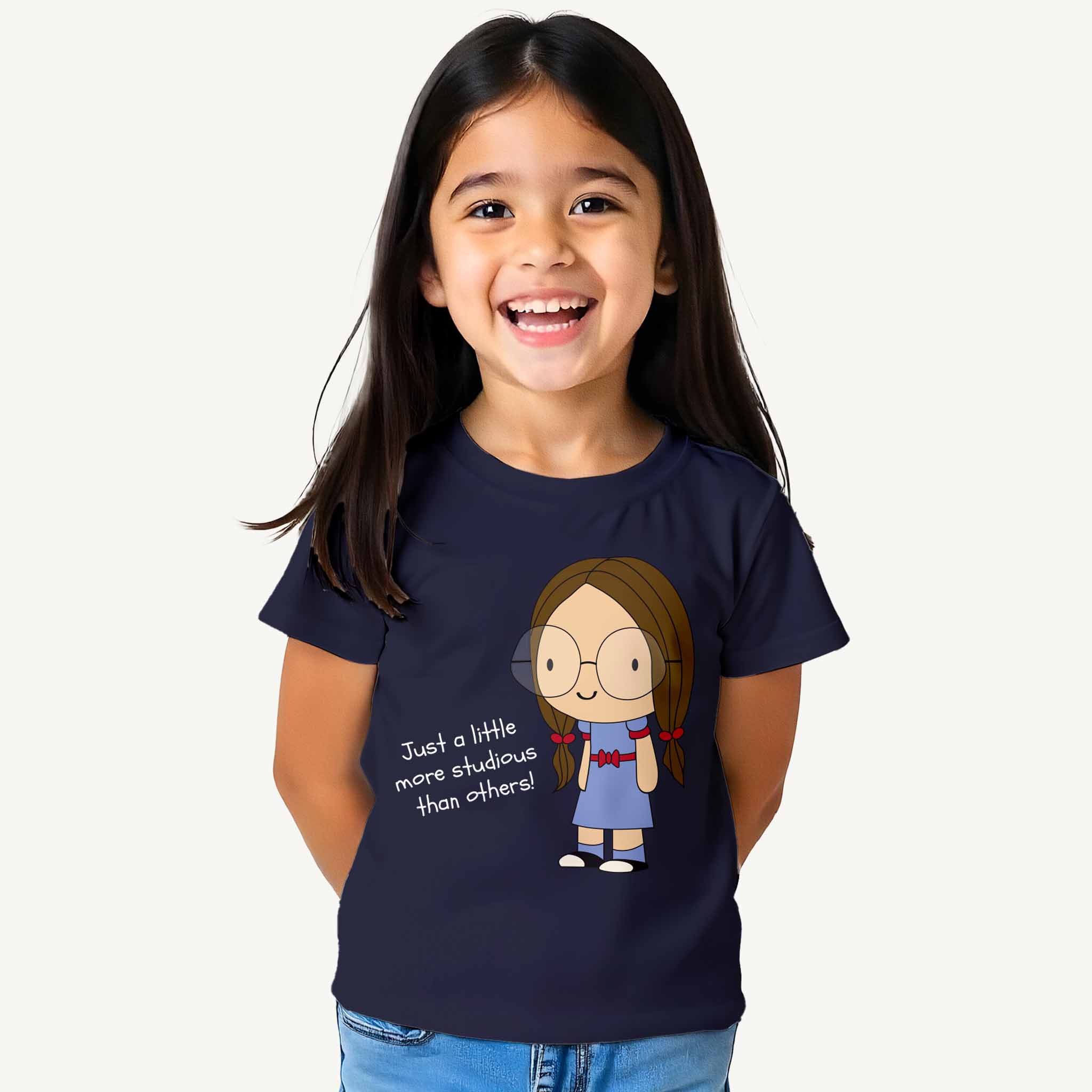 Child wearing a navy blue t-shirt with a cartoon character and text on a white background