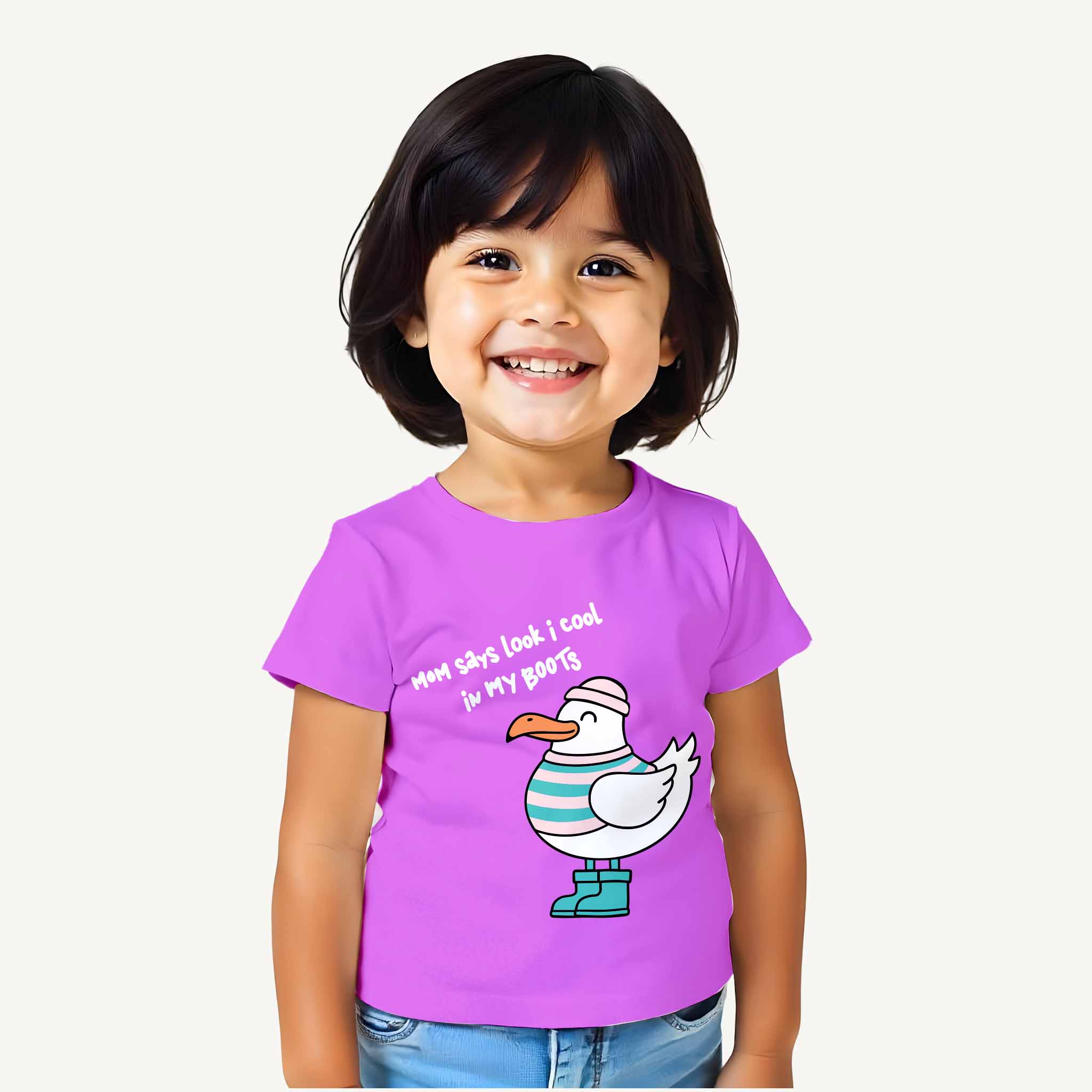 Child wearing a purple t-shirt with a cartoon seagull design on a white background