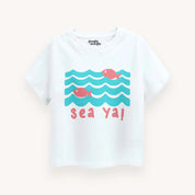 Children's t-shirt with whale and wave design on a white background