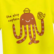 Yellow t-shirt with a brown octopus design and text 'the ship captain' on a yellow background.