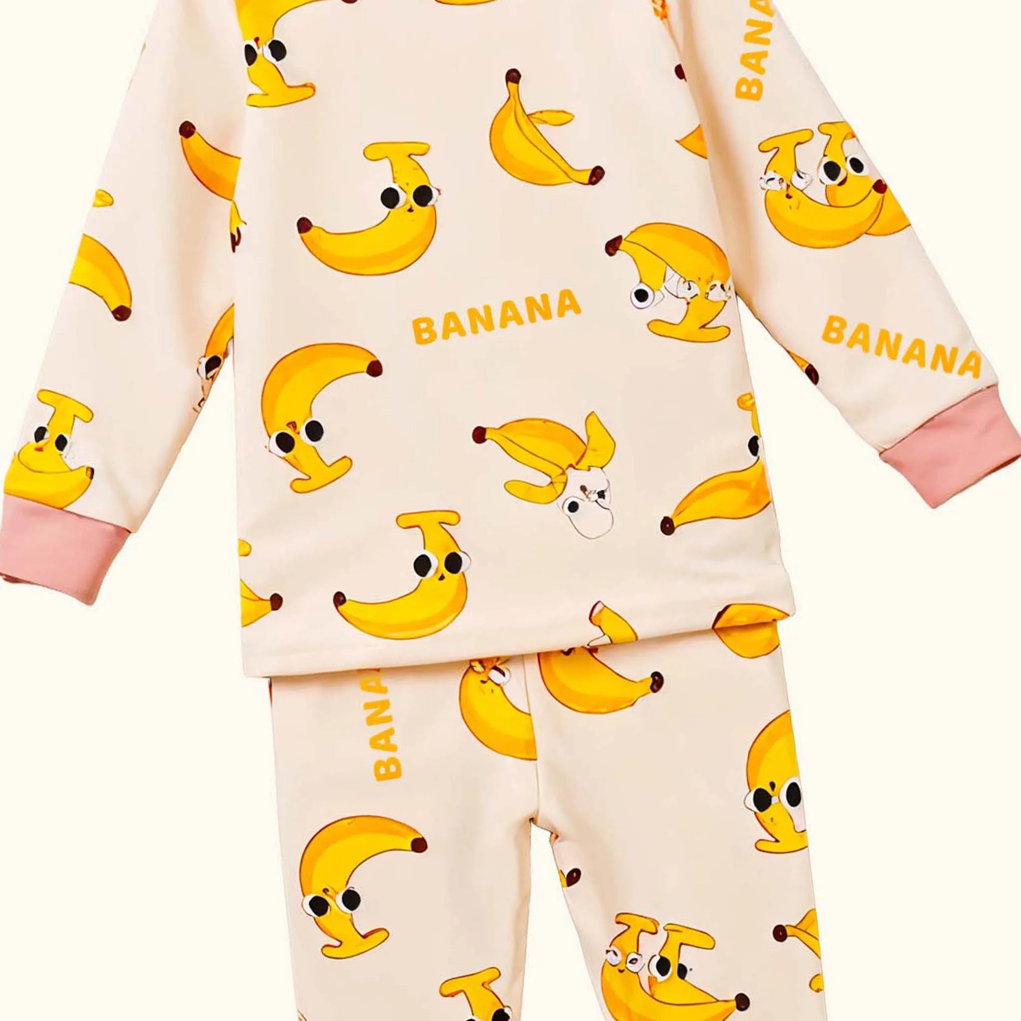 Children's pajama set with banana pattern on a beige background