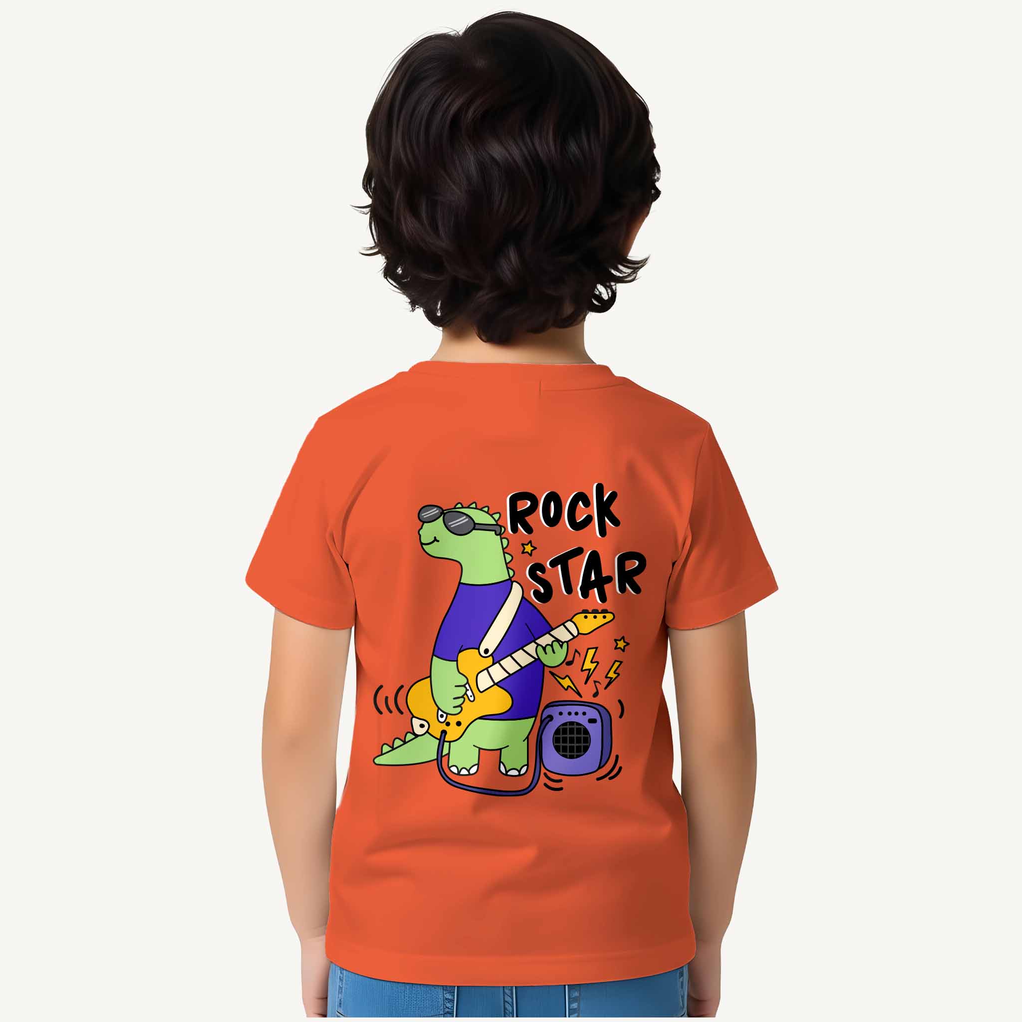 Child wearing an orange t-shirt with a dinosaur graphic and 'Rock Star' text on the back.