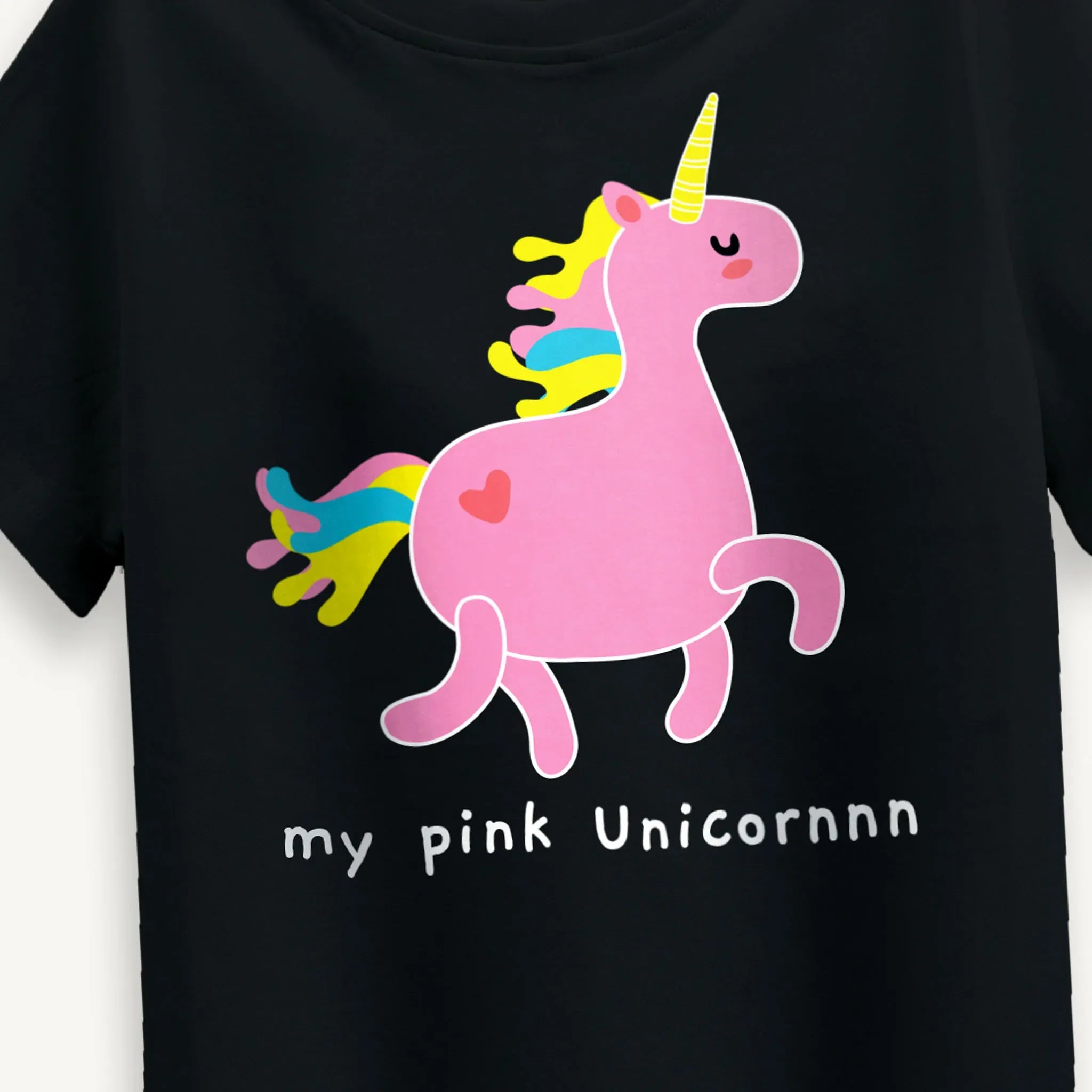 Close-up of the Girls Pink Unicorn T-Shirt in Black highlighting the detailed unicorn print and soft fabric.