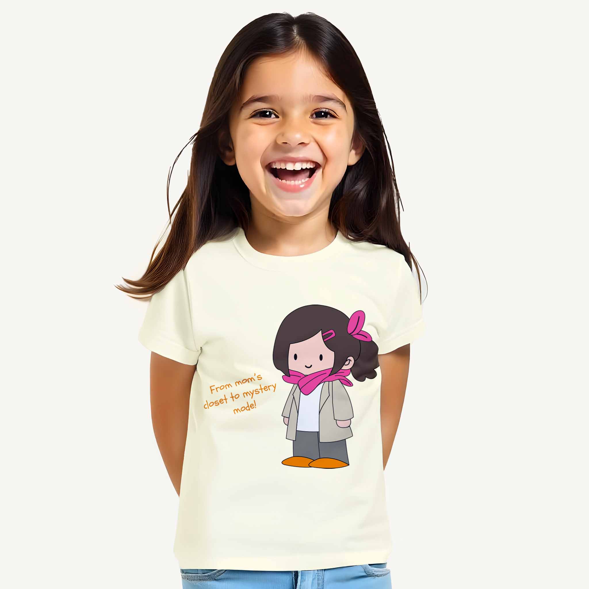 Child wearing a off white t-shirt with a cartoon character and text on a plain background