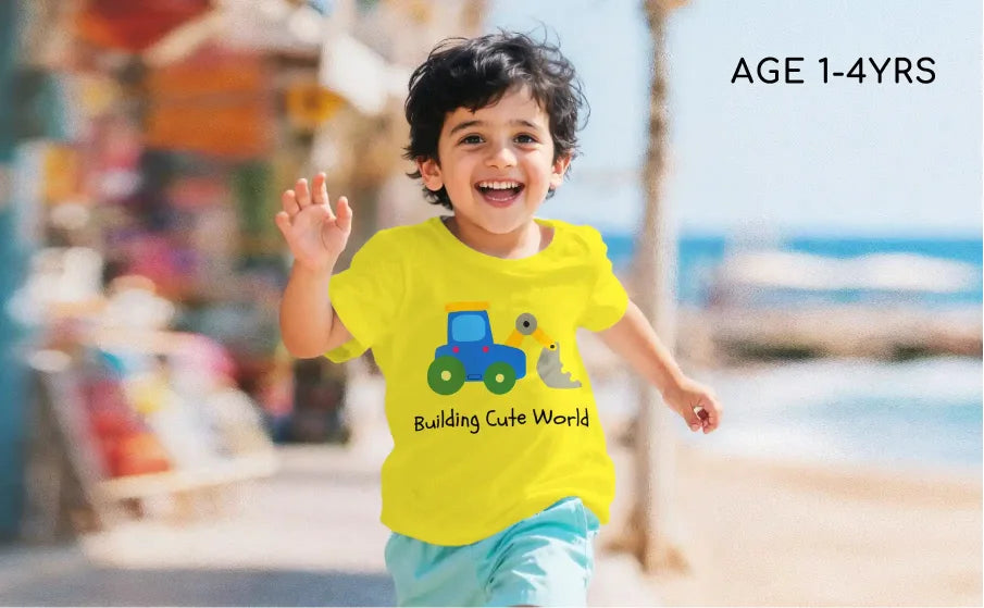 Child wearing a yellow t-shirt with a blue truck design, running outdoors.